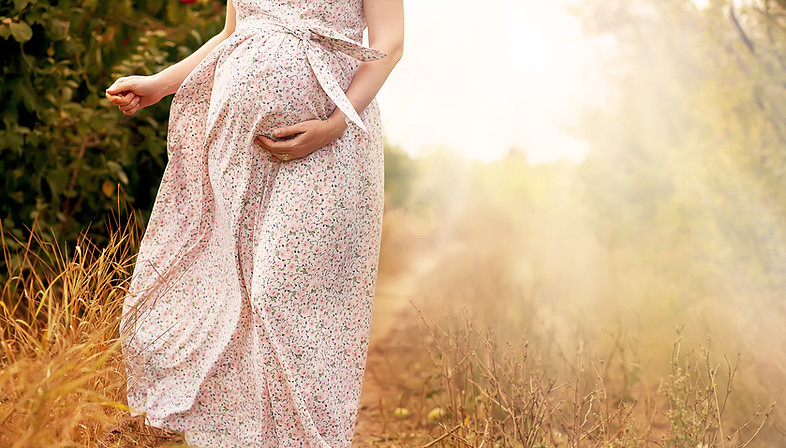 Pregnant woman outdoors