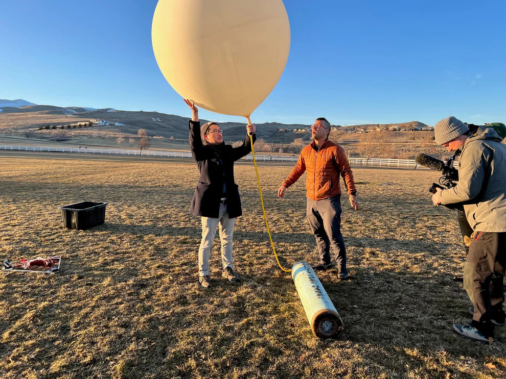 Make sunsets team releasing a balloon