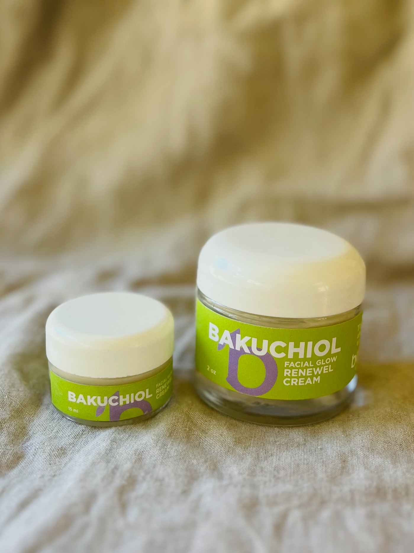 A jar of GLOW Bakuchiol Renewal Cream against a soft cream background.