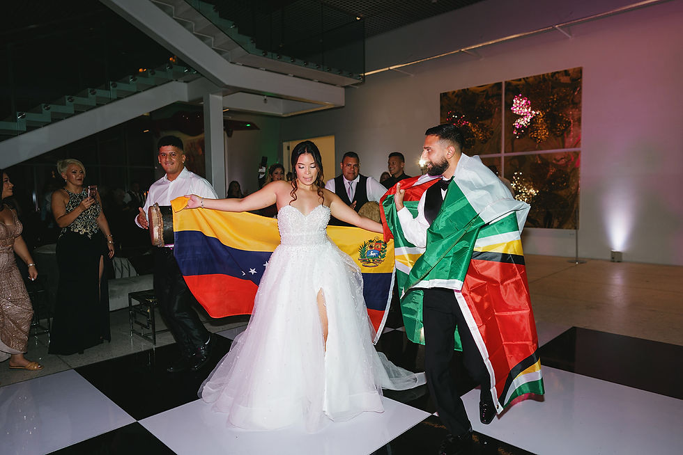Bride and groom surprise dance with flags