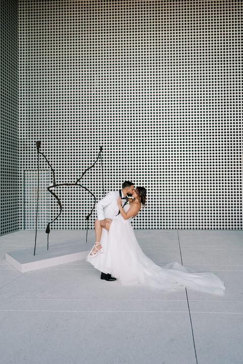 Bride and groom kissing