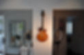 Collings City Limits Deluxe electric guitar hanging on wall