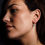 Thumbnail: Model wearing blue topaz drop earrings.