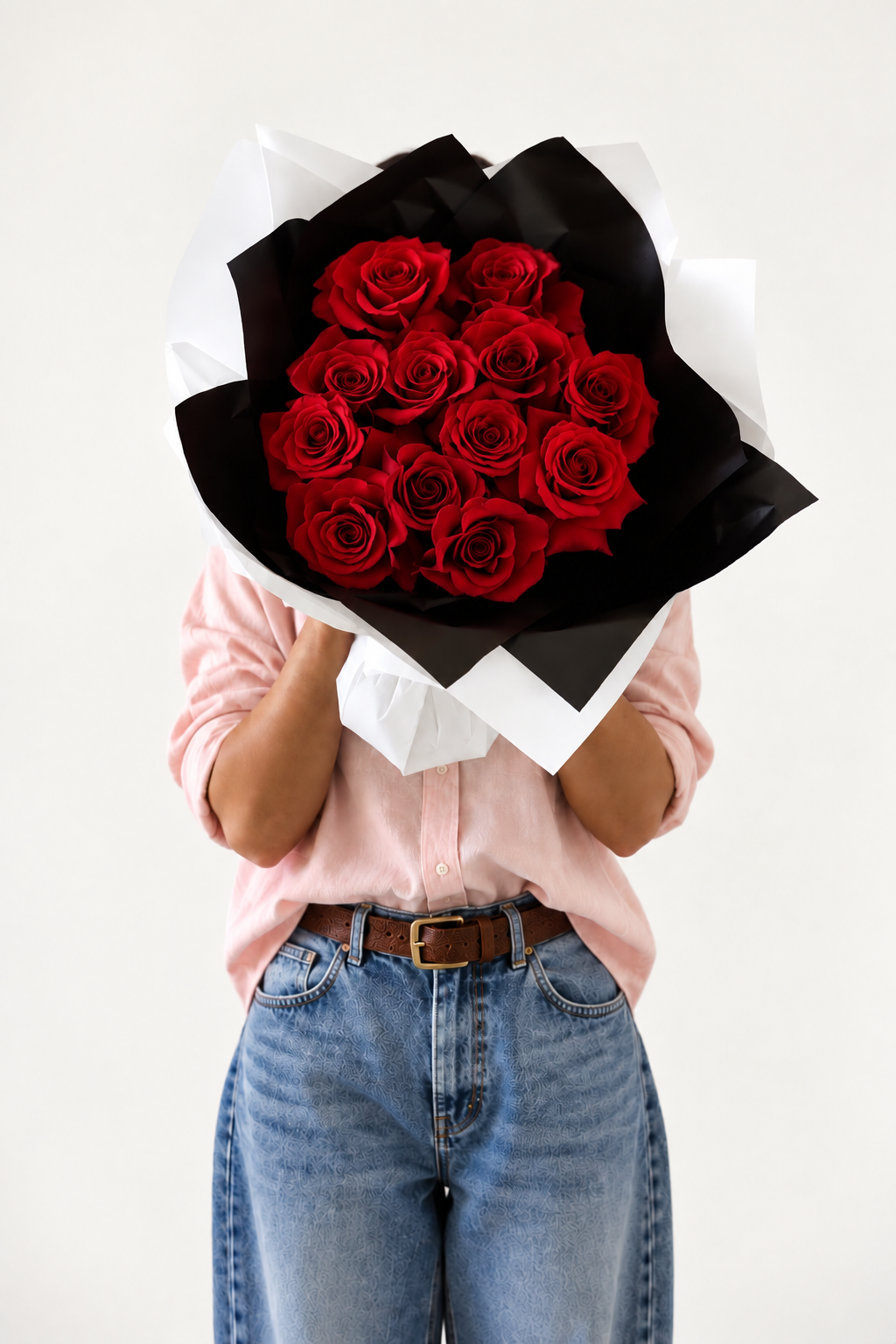 Dozen red rose bouquet wrapped in black and white paper