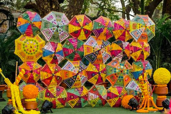 wedding backdrop made with colourful umbrellas