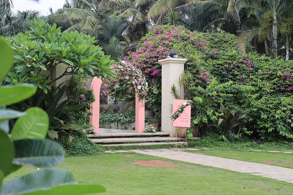 floral entrance arch with welcome board at tamara