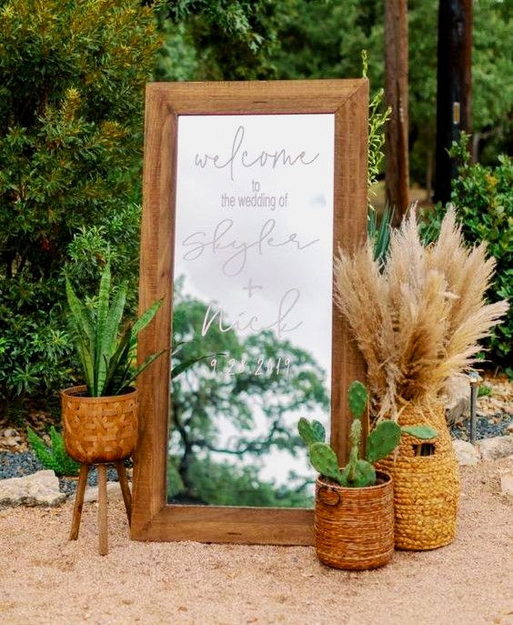wedding welcome board that is an engraved mirror