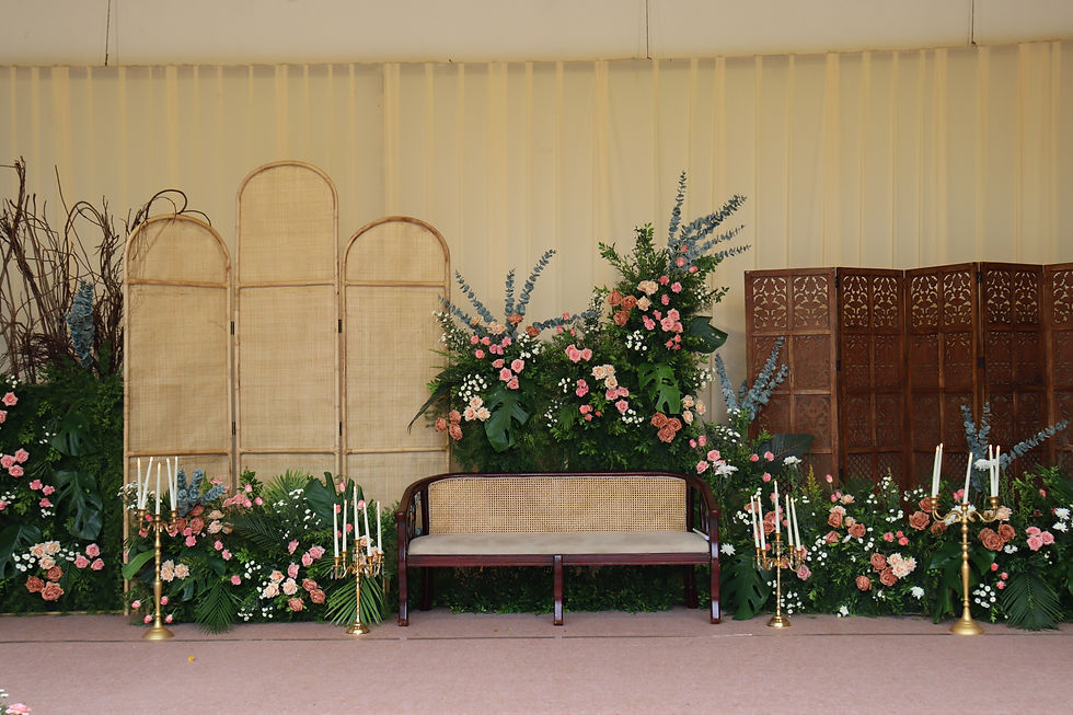 seating decor on tamara mandapam with flower arrangement and candles for engagement