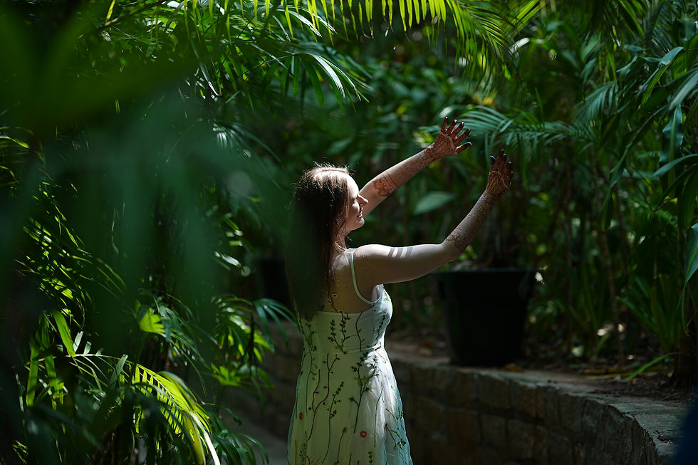 Wedding photography by Meragi of a bride amidst plants