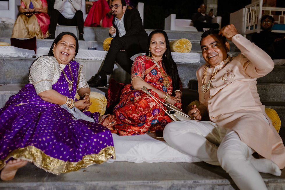 guests during wedding, on the pavilion steps with gadda and cushions