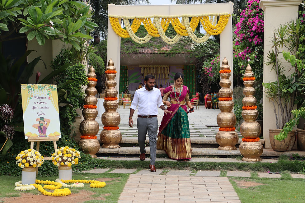 real couple with their haldi and bale shastra entrance decor at tamara