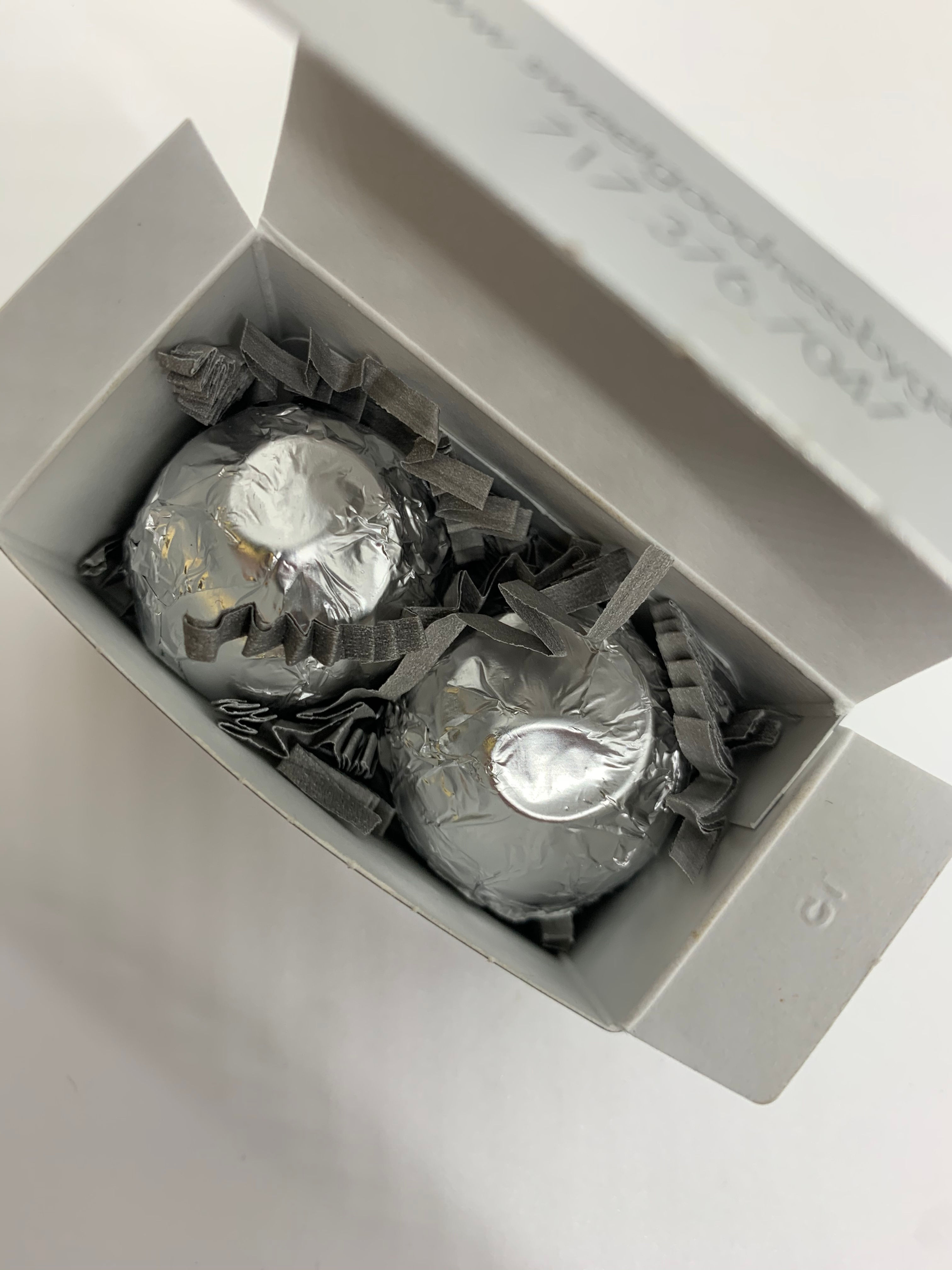 2 FOIL-WRAPPED TRUFFLES IN A MINI BOX