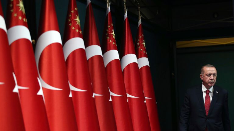 urkey's President Recep Tayyip Erdogan walks before announcing early presidential and parliamentary elections. Photo Credit: AP