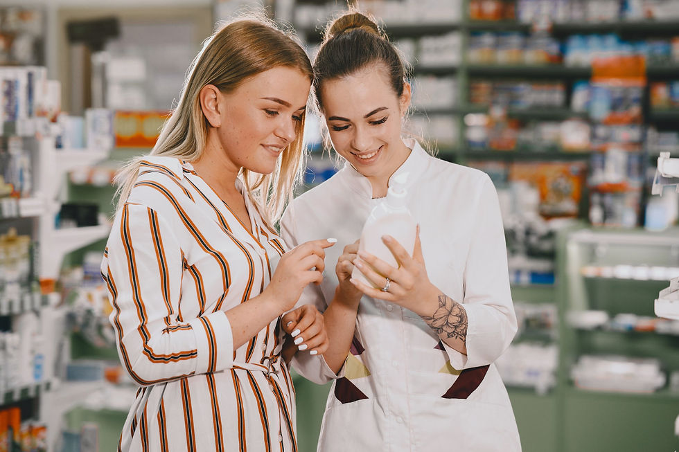 medicine-pharmaceutics-health-care-people-concept-female-pharmacist-advises-buyer (2).jpg