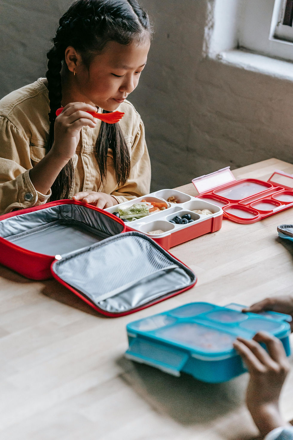 A girl eating from her healthy lunch box