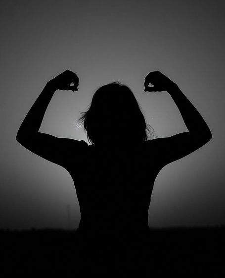 Silhouette of a person raising their arms in empowerment, representing resilience and sexual assault survivor support.