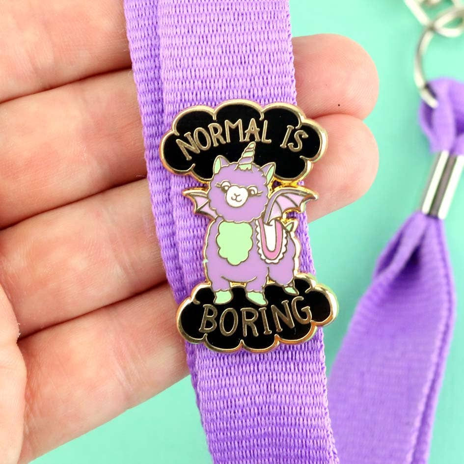Thumbnail: A cute enamel pin featuring a pastel purple and mint-green llama with bat wings and a unicorn horn, surrounded by black cloud