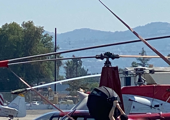 Crew on the helicopter tarmac prepping the poacher scene.
Image Giselle Joves.