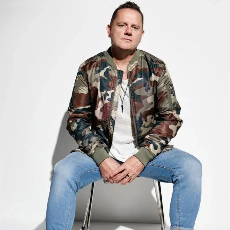 John Course sitting in camo jacket