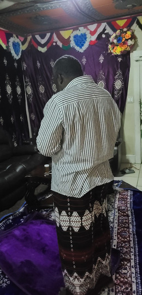 Famo's father praying.