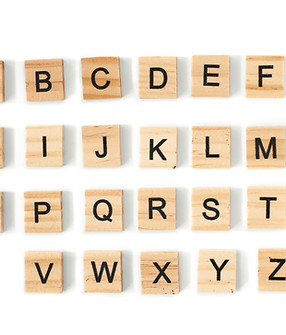 Top view of english alphabet made of square wooden tiles with the English alphabet scatter
