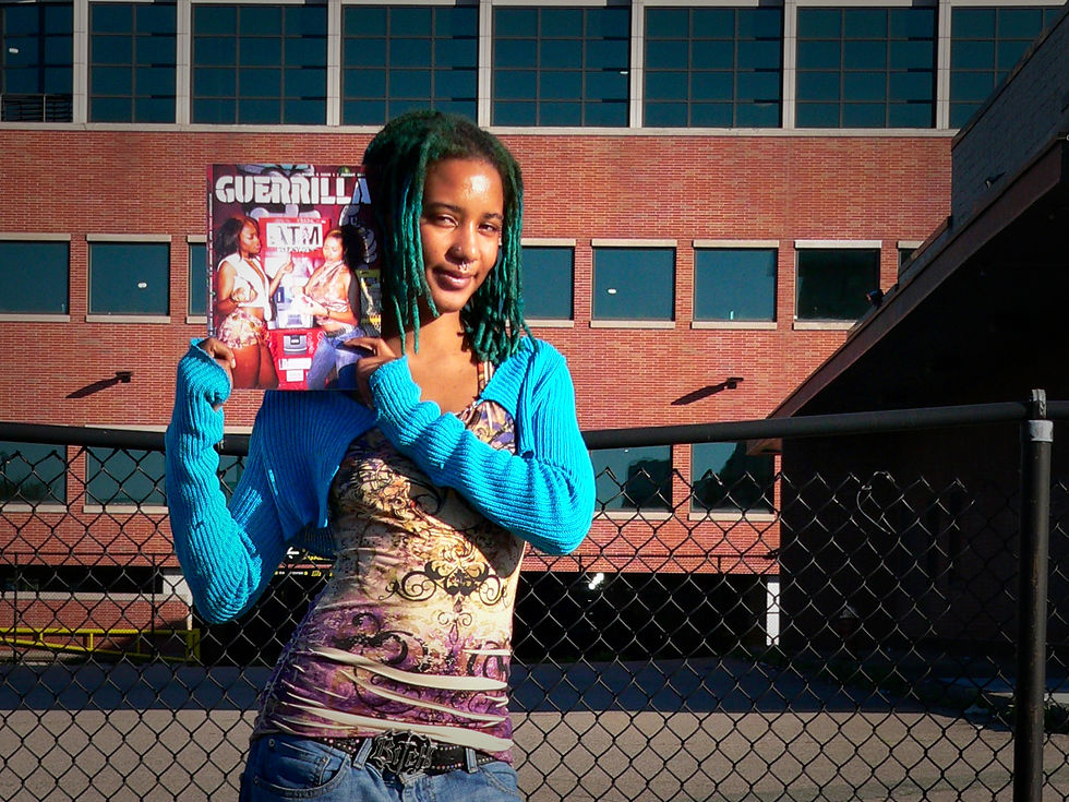 Vikiana Petit-Homme poses with a copy of Geurrilla Mag in Dorchester earlier this May 2026.