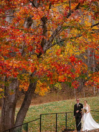 bride and groom pose for a photo at Delaney Ridge, Western NC mountain wedding venue