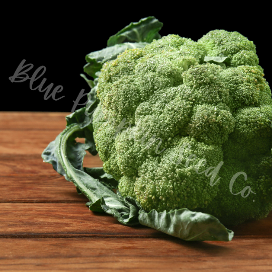 Thumbnail: A crown of Calabrese broccoli on a wooden table.
