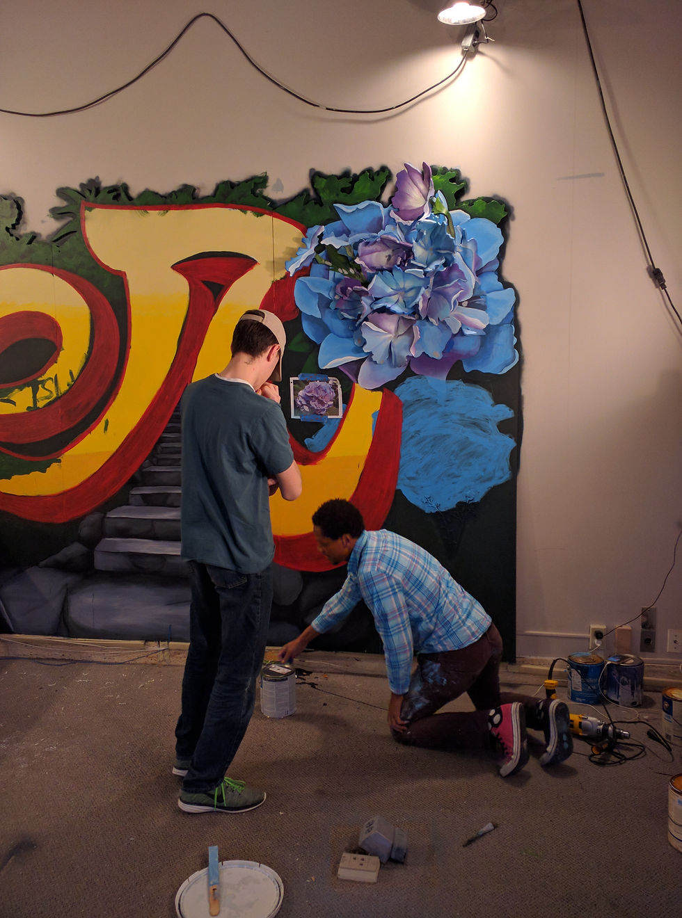 Jack taking direction from muralist Shawn Dunwoody.