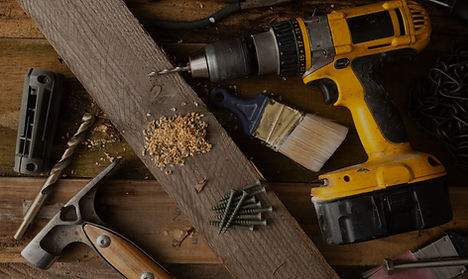 A variety of tools, including a hammer a