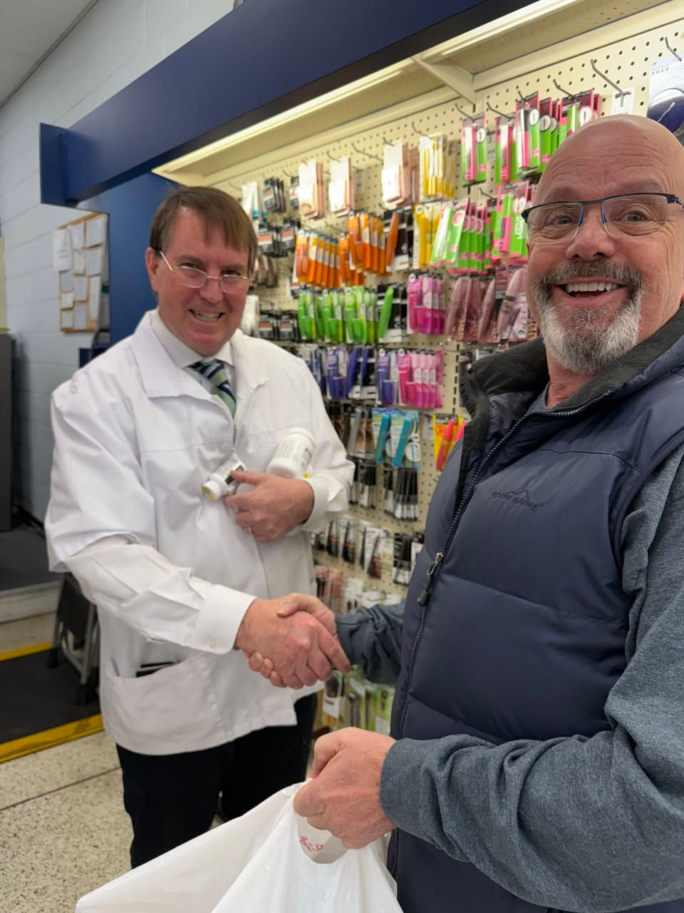 Curt shaking hands with the pharmacist at Montpelier Pharmacy