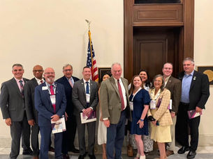 Curt Reichstetter, 2026 President of Virginia REALTORS, with Sen. Tim Kaine and Virginia REALTORS members on Capitol Hill, June 2026