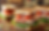 Close-up of italian hero sandwiches with turkey, cheese, bacon, lettuce, and tomato on toasted bread. Garnished with picks. Rustic wood background.