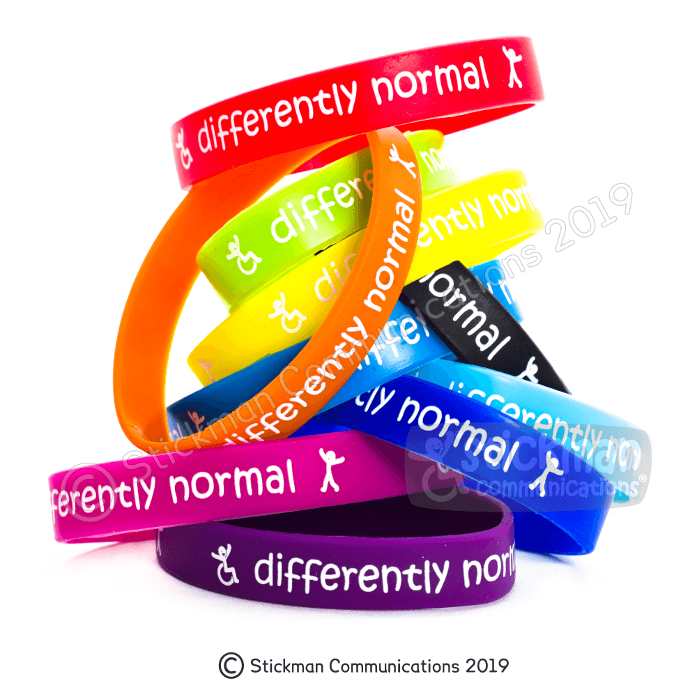 colourful pile of silicone wristbands, each says 'differently normal' - with a wheelchair symbol and a walking person symbol.