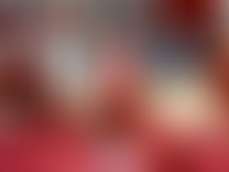 A confident woman in casual, cheerful attire holds pom-poms and smiles brightly, embodying the spirit of self-encouragement and learning to celebrate personal growth without guilt.