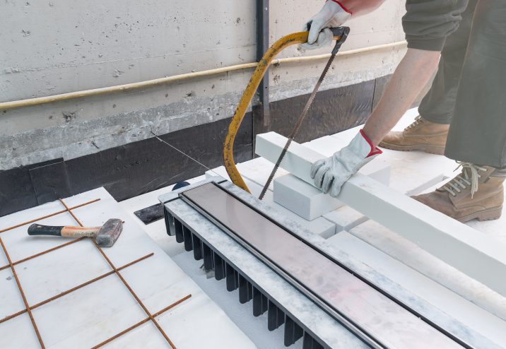 CMSA monitoring workers precisely cutting wooden blocks on site in Hong Kong during the structural preparation
