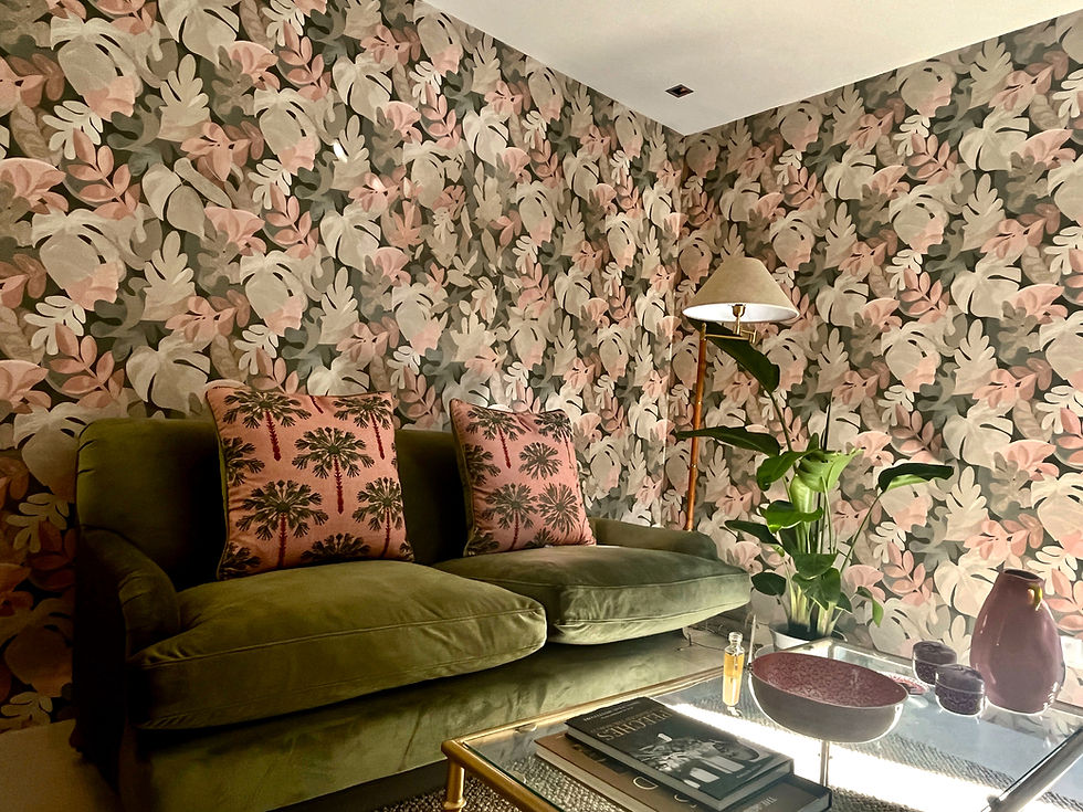 green and pink wallpaper, green velvet sofa, small living room