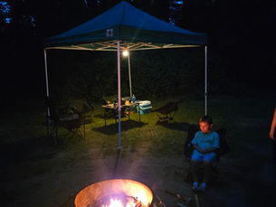 Our camp setup with Teddy sitting around the fire