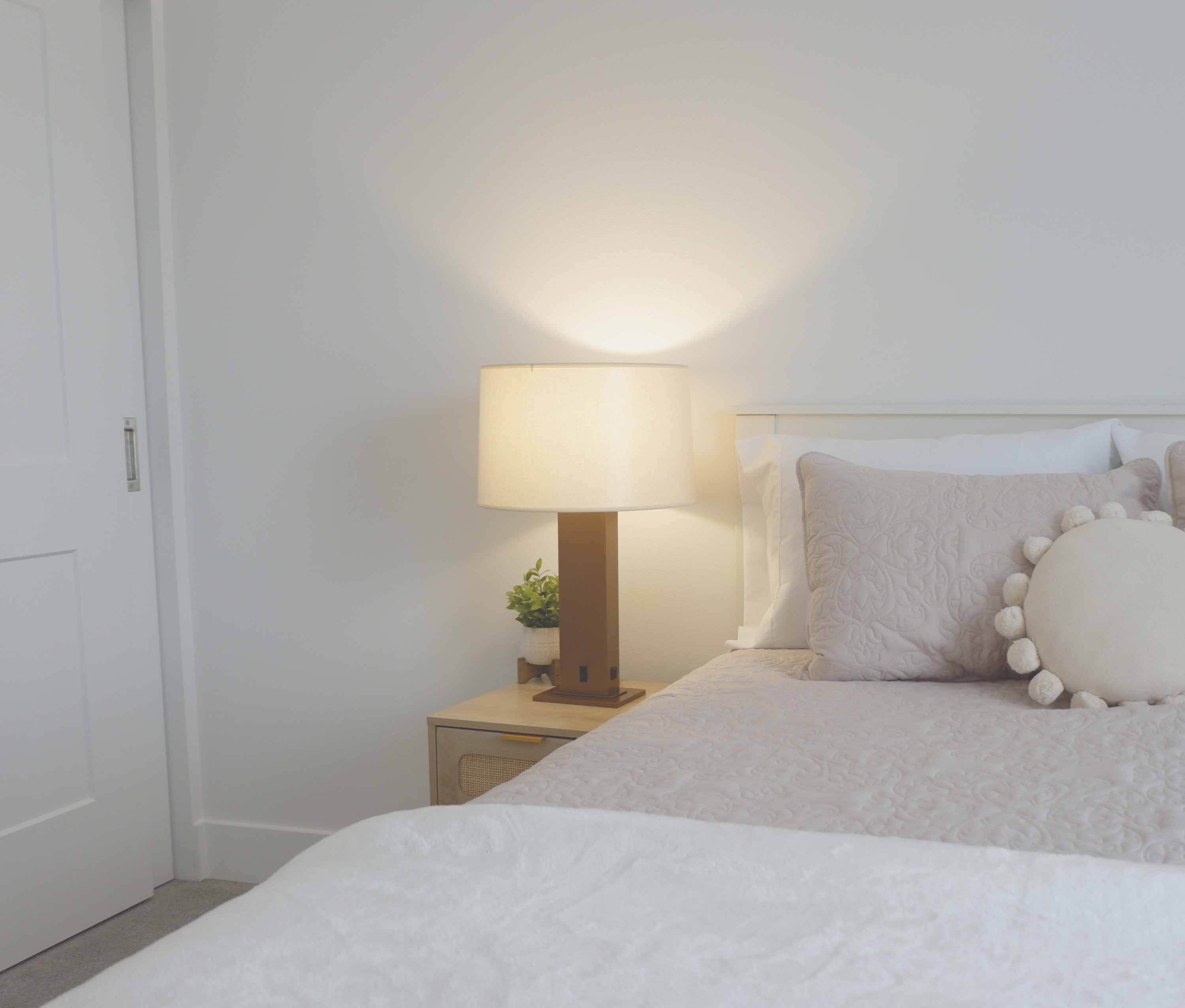 JES Lighting — lamp on bedside table