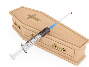 closed coffin with a syringe and a needle