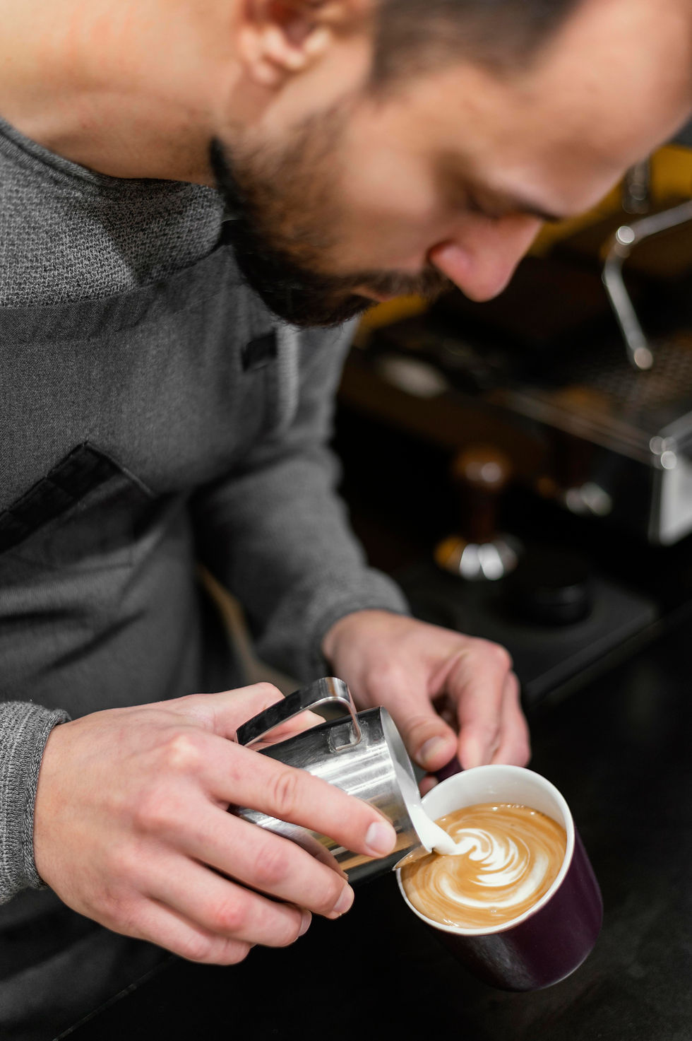 male-barista-preparing-coffee.jpg