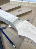 Carving the headstock -  the image shows a partially completed Malone Guitars electric guitar neck. The neck is made from birds eye maple.
