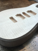 Back and top - glued - a close up of a partially complete Malone Guitars guitar body. 