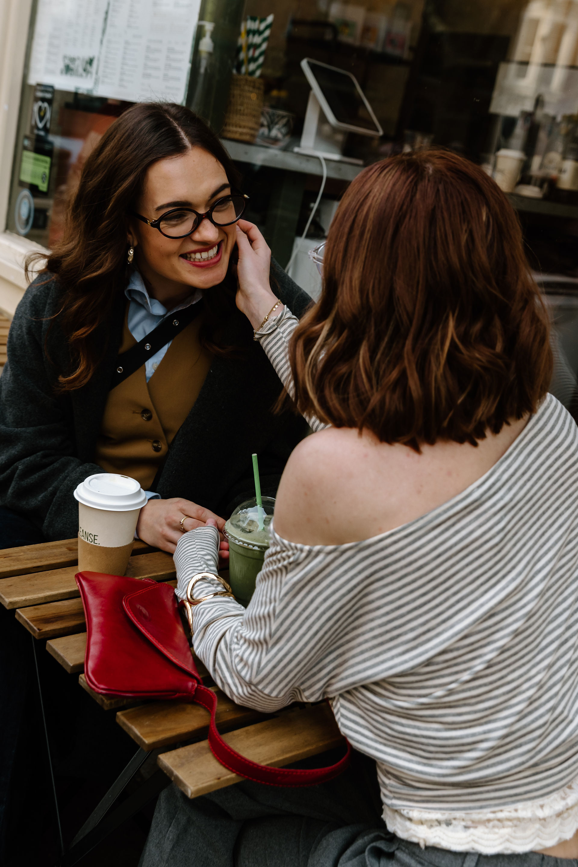 Partners at cafe laughing during a couples session in Notting Hill London