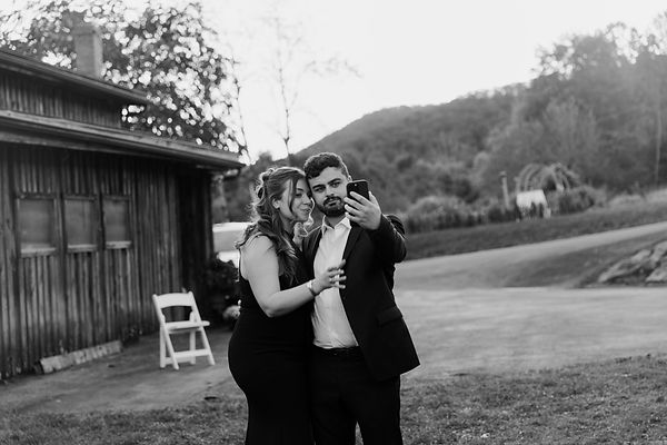 Wedding guests taking photo during an elopement in New England