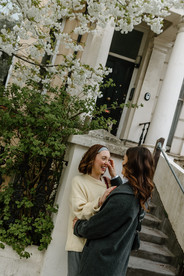 Couple outside Notting Hill house during destination photoshoot in London England
