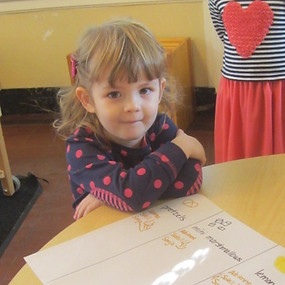 Toddler smiling in preschool