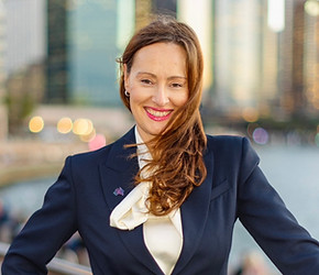 Ruthless Ventures founder and CEO Stef Winwood, Sydney harbour. Woman in navy suit outside in Sydney Harbour