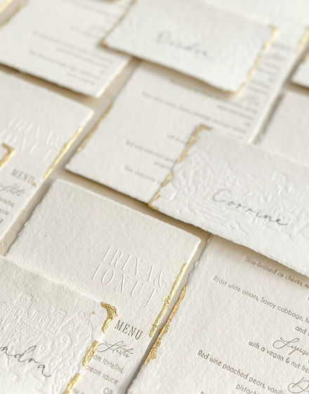 Letterpress menus with gilded deckled edges