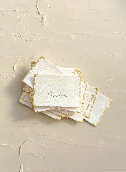 Deckled place cards with gold edges and calligraphy